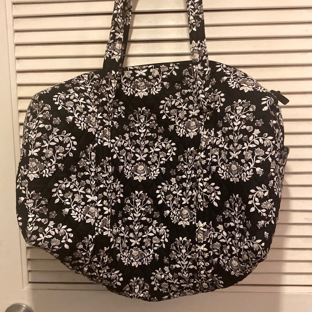 Vera Bradley duffel with zipper.